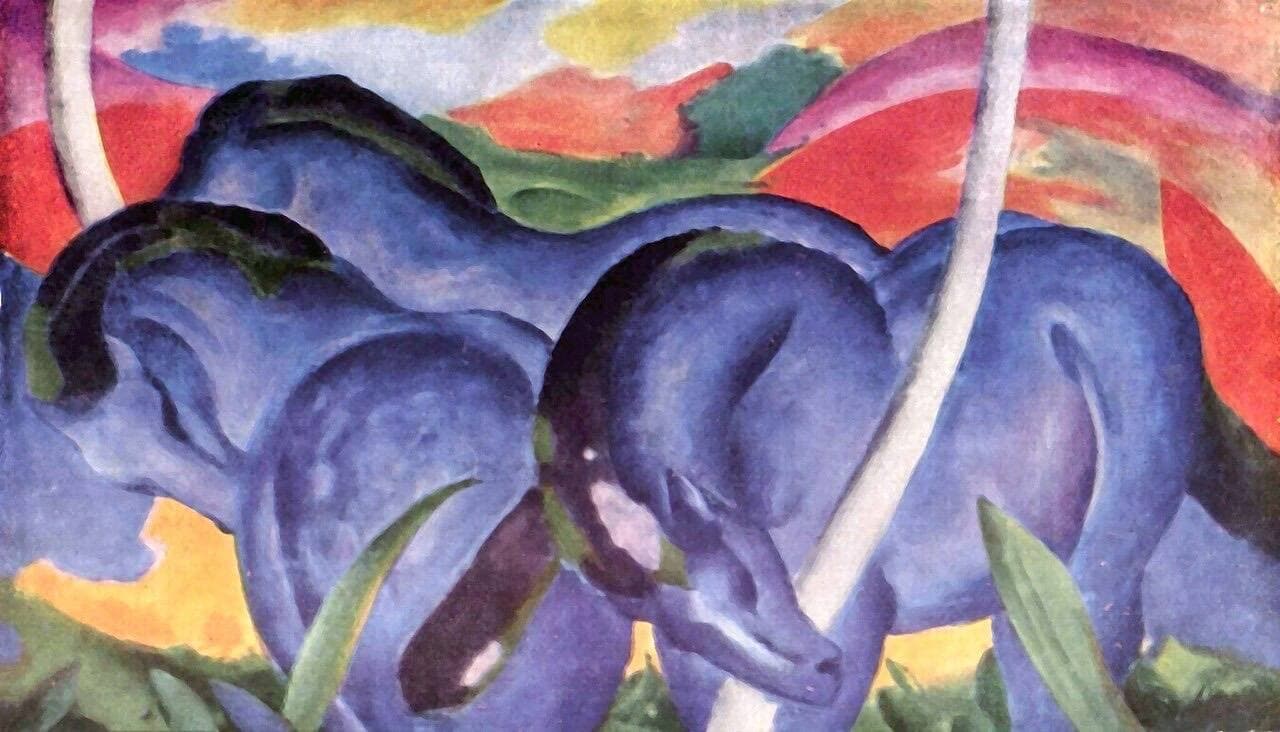 Marc's The Large Blue Horses: three blue horses with their heads bowed, against red and yellow hills.