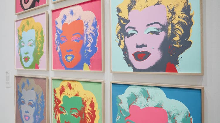 Wall of framed Pop art Marilyn screenprints in vivid colour