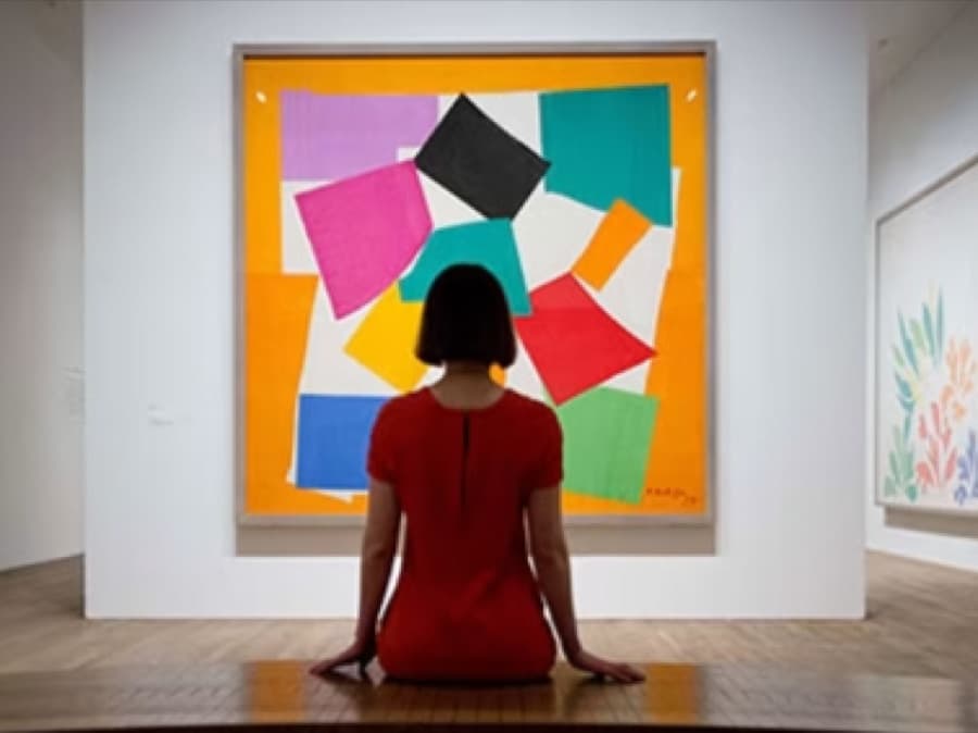 [Placeholder image] Visitor viewing a work in the gallery