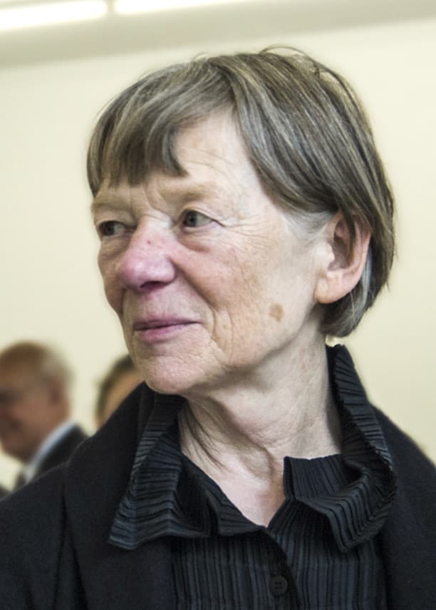 Candida Höfer, grey haired, in a dark jacket, looking to one side