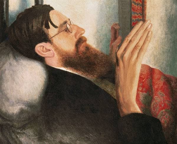 Carrington's portrait of Lytton Strachey: the writer, bearded and bespectacled, lies back reading, his long hands raised to the page.