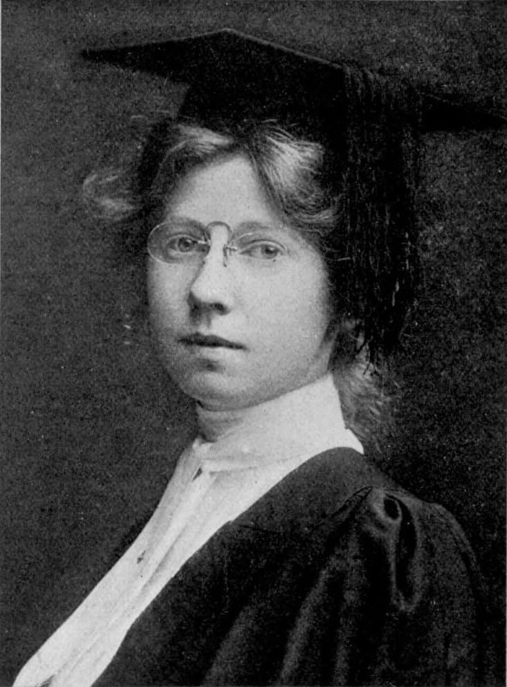 Imogen Cunningham as a young woman in pince-nez, in cap and gown.