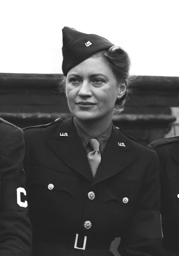 Lee Miller in US Army uniform and cap, looking to one side, in 1943