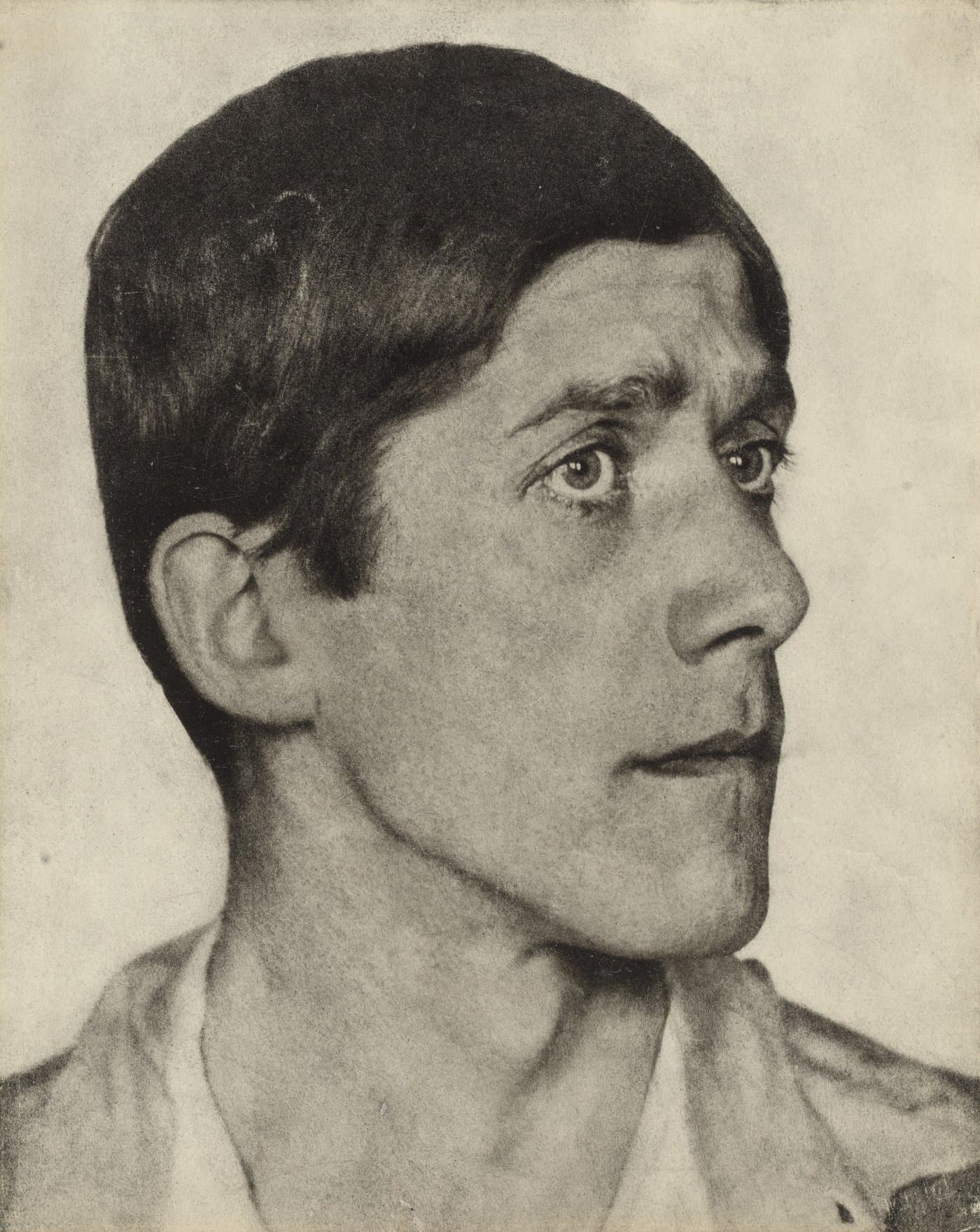 Oskar Kokoschka in profile, with dark cropped hair and wide eyes.