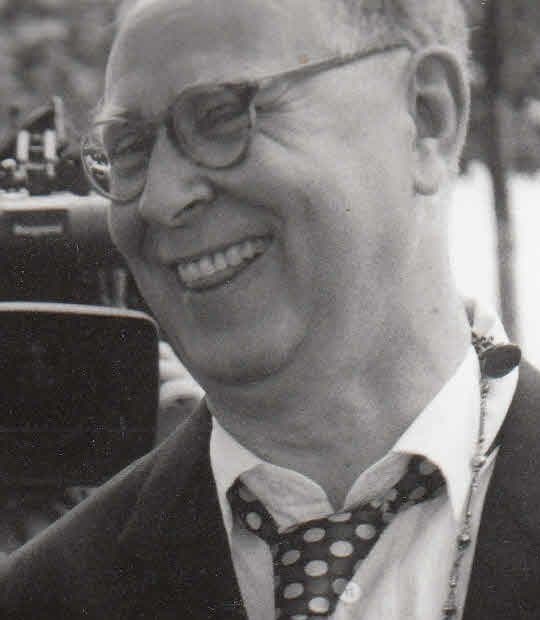 Sigmar Polke in glasses, smiling.