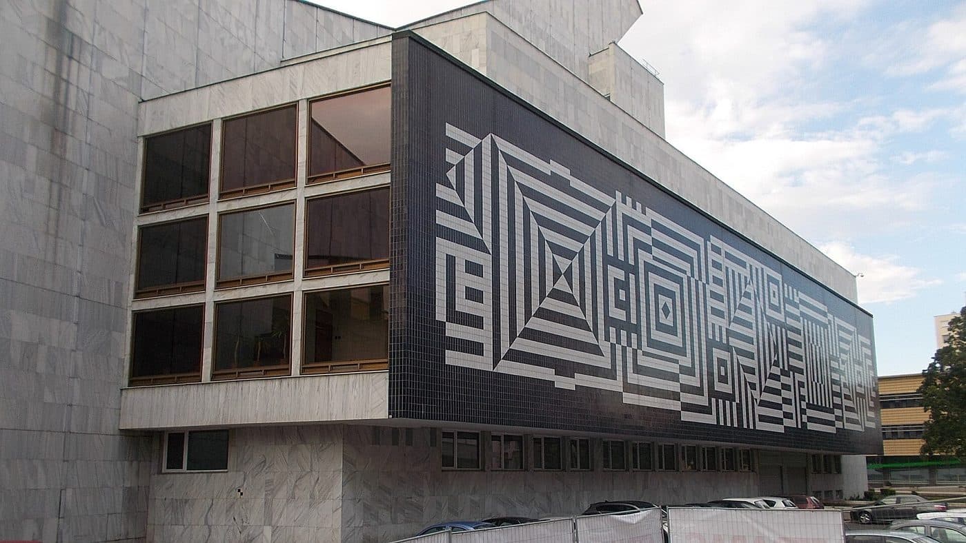 Black-and-white geometric panels by Victor Vasarely running across the facade of the National Theatre in Győr, Hungary.