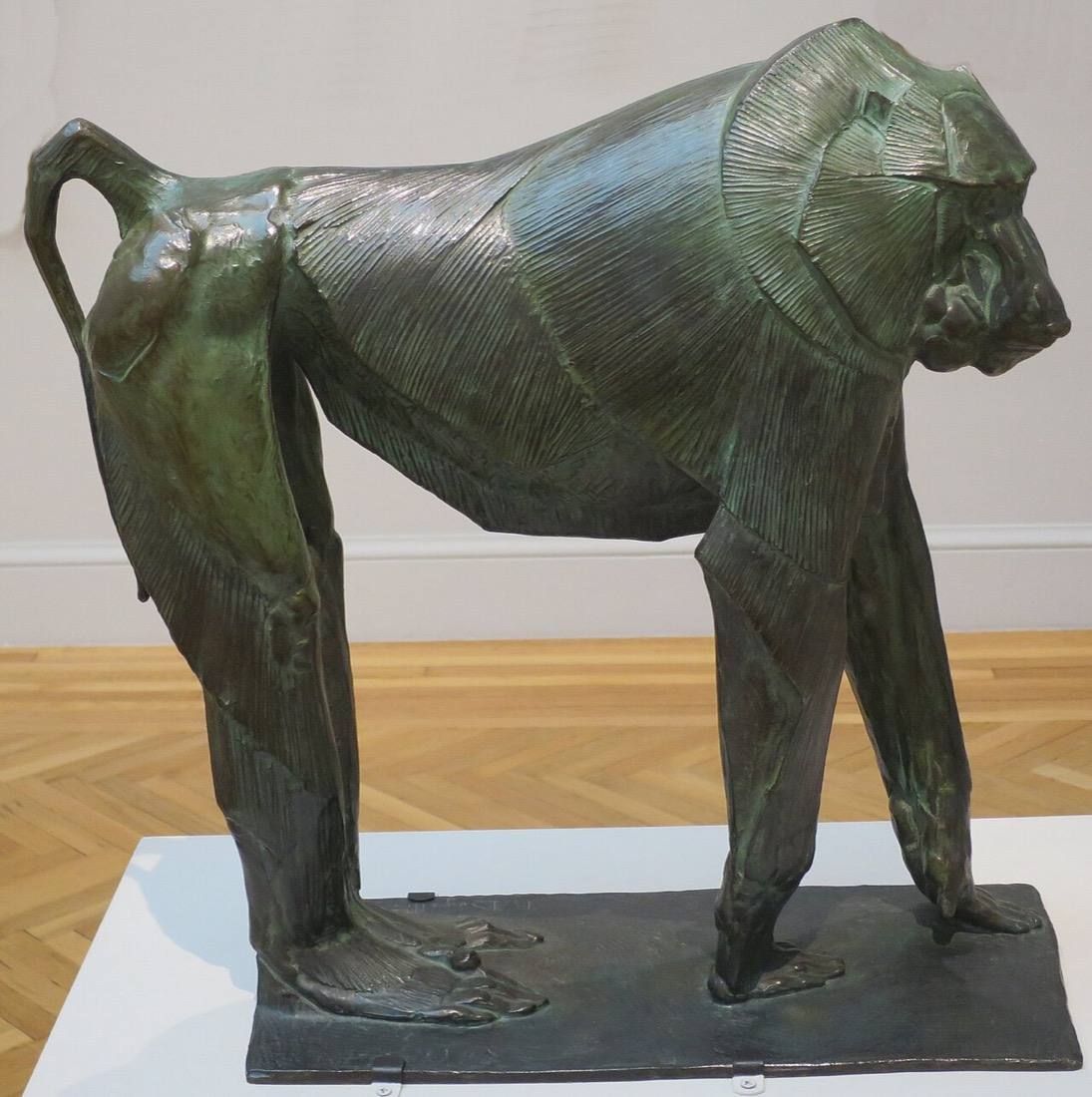 Bugatti's Hamadryas Baboon: a bronze baboon standing on all fours on a low base.