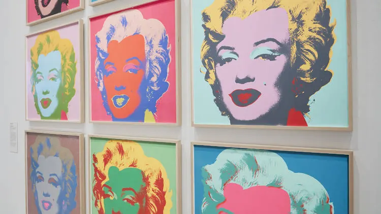 Wall of framed Pop art Marilyn screenprints in vivid colour