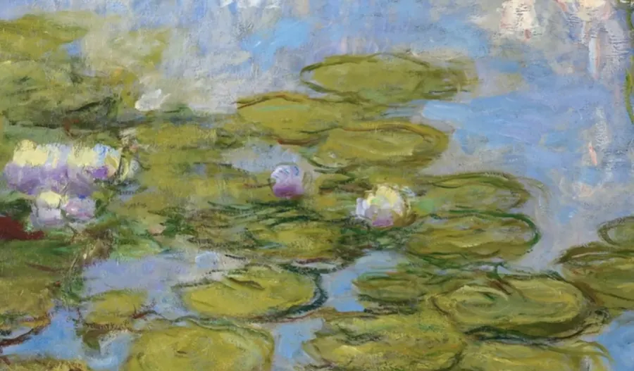 Detail of an Impressionist painting of water lilies: pink and white flowers among green pads on blue water